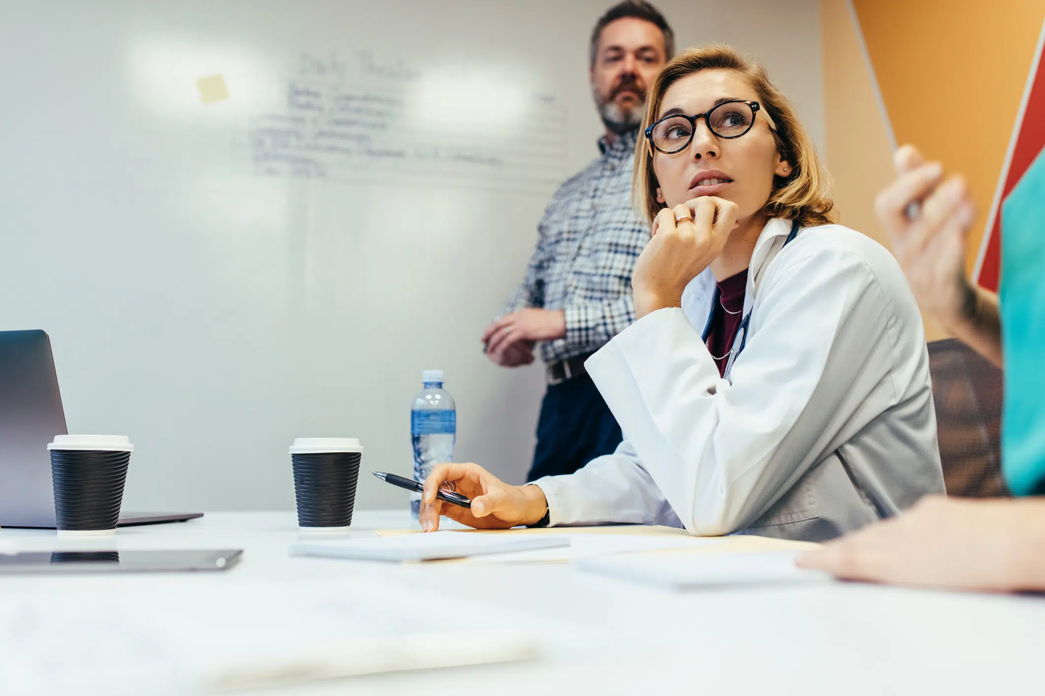 Female medical professional thinking