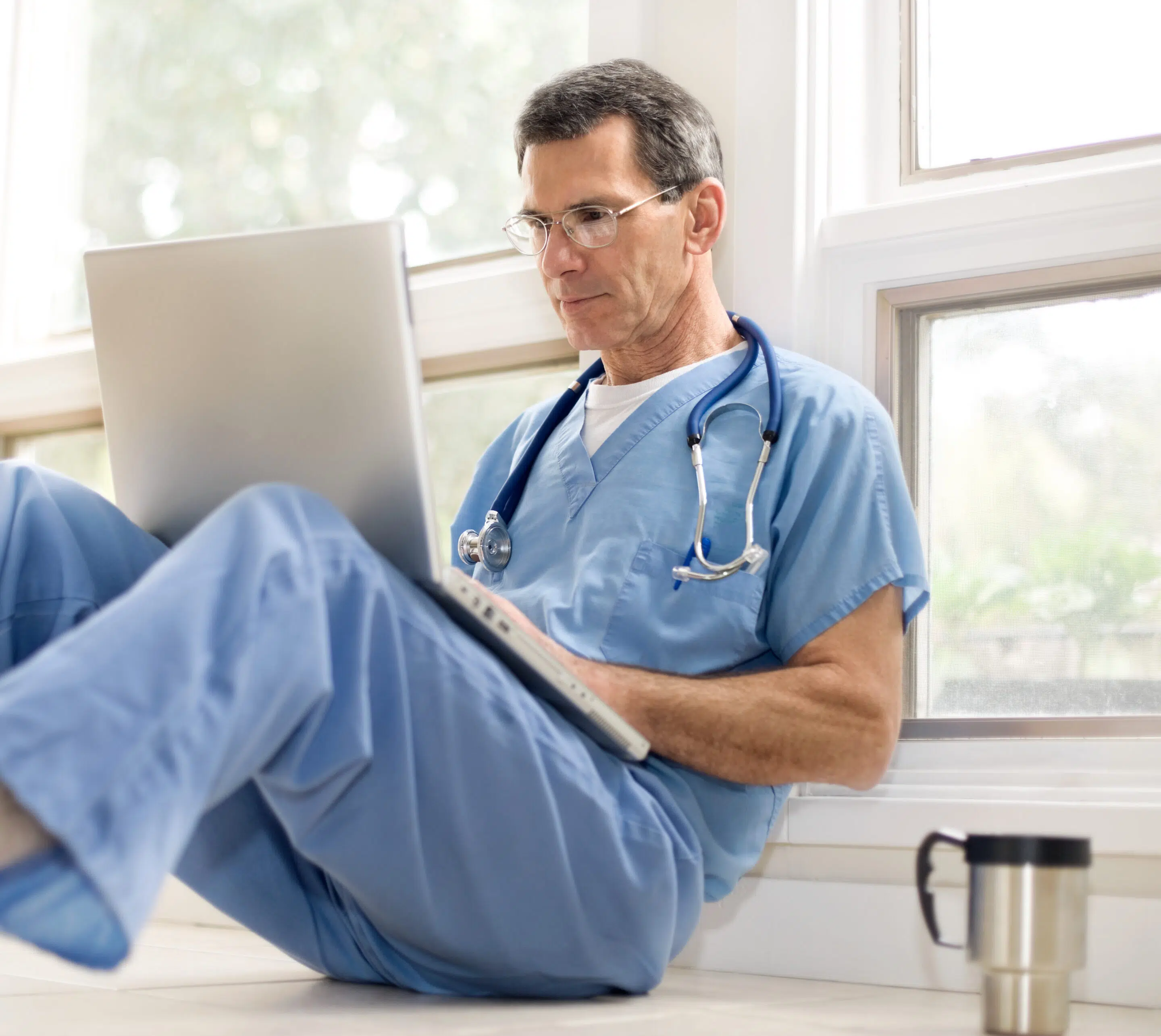 Doctor working on laptop